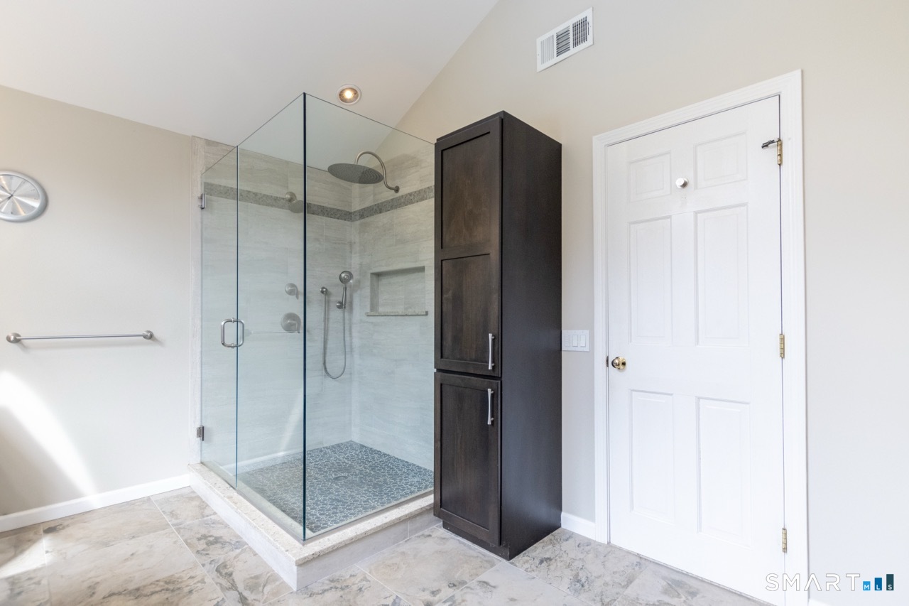 16 Shadowood Lane Trumbull, CT 06611 - Photo 20 of 39 a bathroom with a shower and a sink