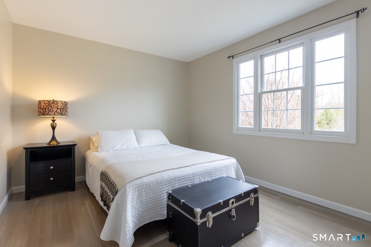 16 Shadowood Lane Trumbull, CT 06611 - Photo 22 of 39 a bedroom with a bed and a window