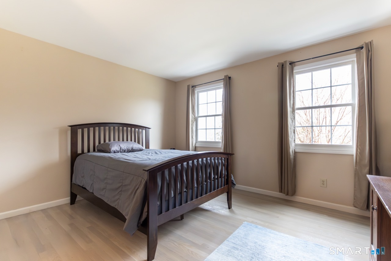 16 Shadowood Lane Trumbull, CT 06611 - Photo 23 of 39 a bedroom with a bed and window