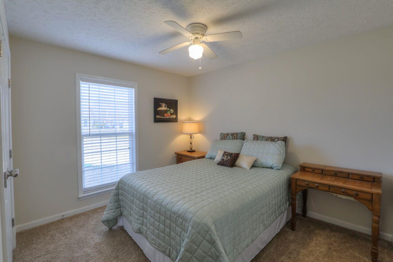 693 Crescent Road Murfreesboro, TN 37128 - Photo 14 of 23 a bedroom with a bed and a ceiling fan
