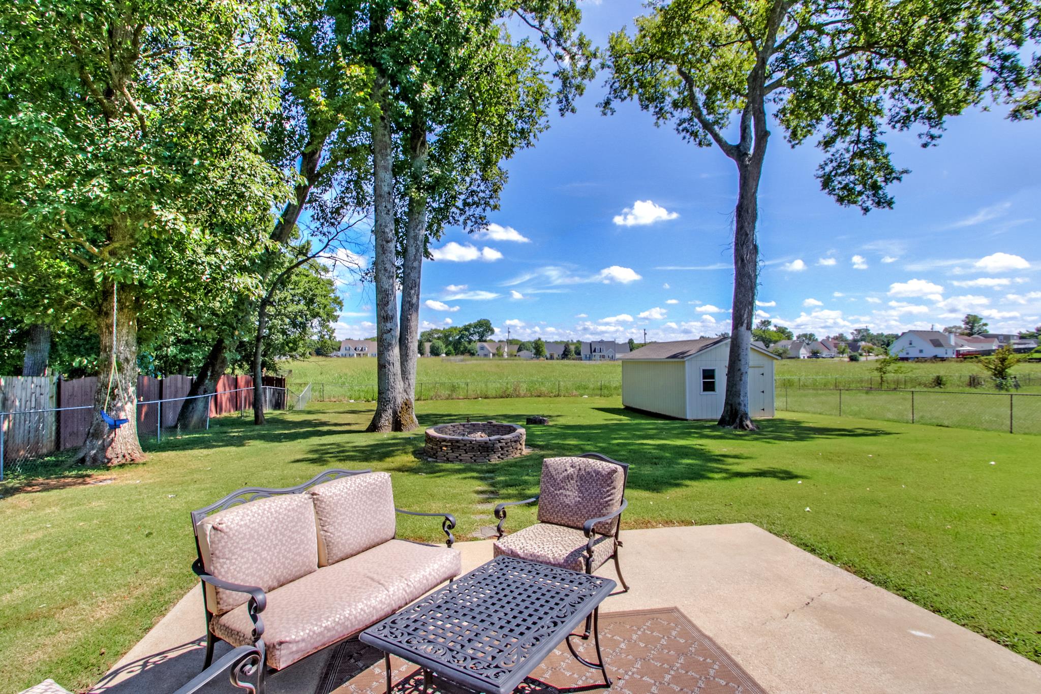 693 Crescent Road Murfreesboro, TN 37128 - Photo 21 of 23 a view of a chairs and table in the garden