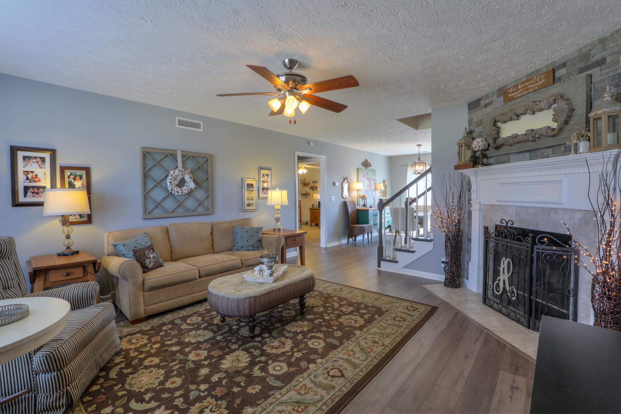 693 Crescent Road Murfreesboro, TN 37128 - Photo 4 of 23 a living room with furniture and a fireplace