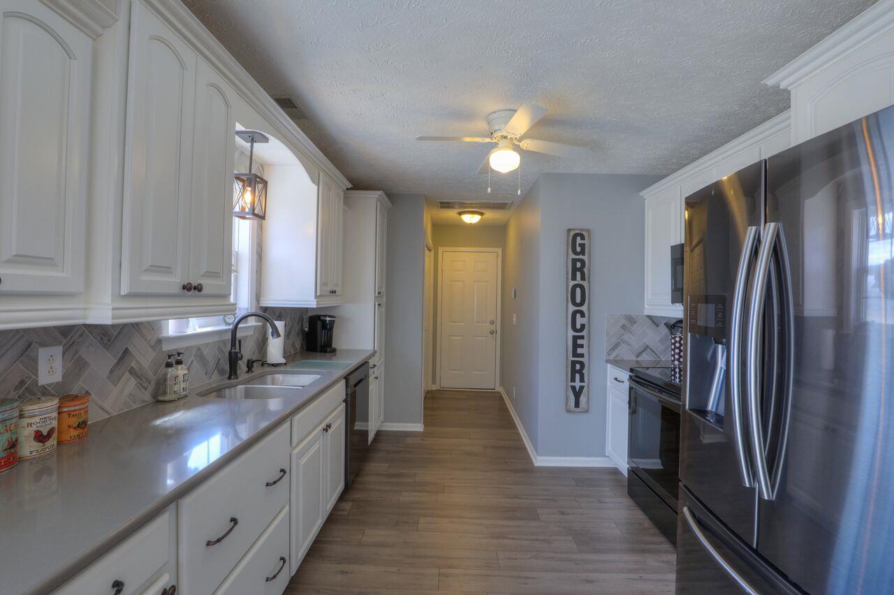 693 Crescent Road Murfreesboro, TN 37128 - Photo 6 of 23 a kitchen with stainless steel appliances granite countertop a refrigerator a sink and dishwasher