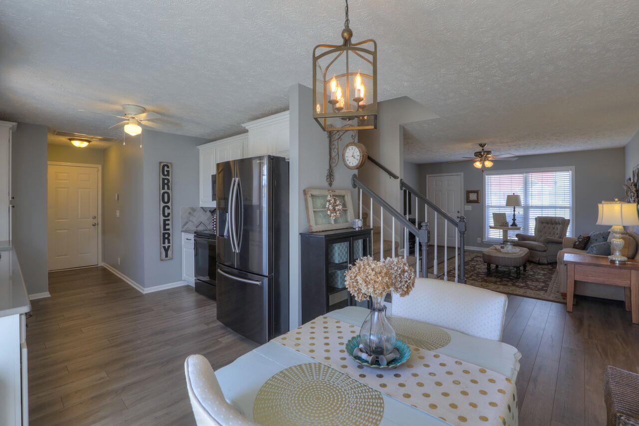 693 Crescent Road Murfreesboro, TN 37128 - Photo 8 of 23 a living room with furniture and a chandelier