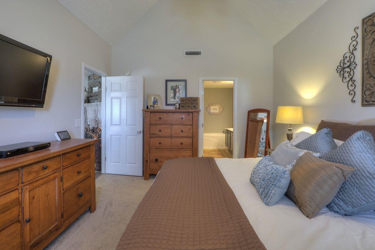 693 Crescent Road Murfreesboro, TN 37128 - Photo 10 of 23 a bedroom with a bed and flat screen tv