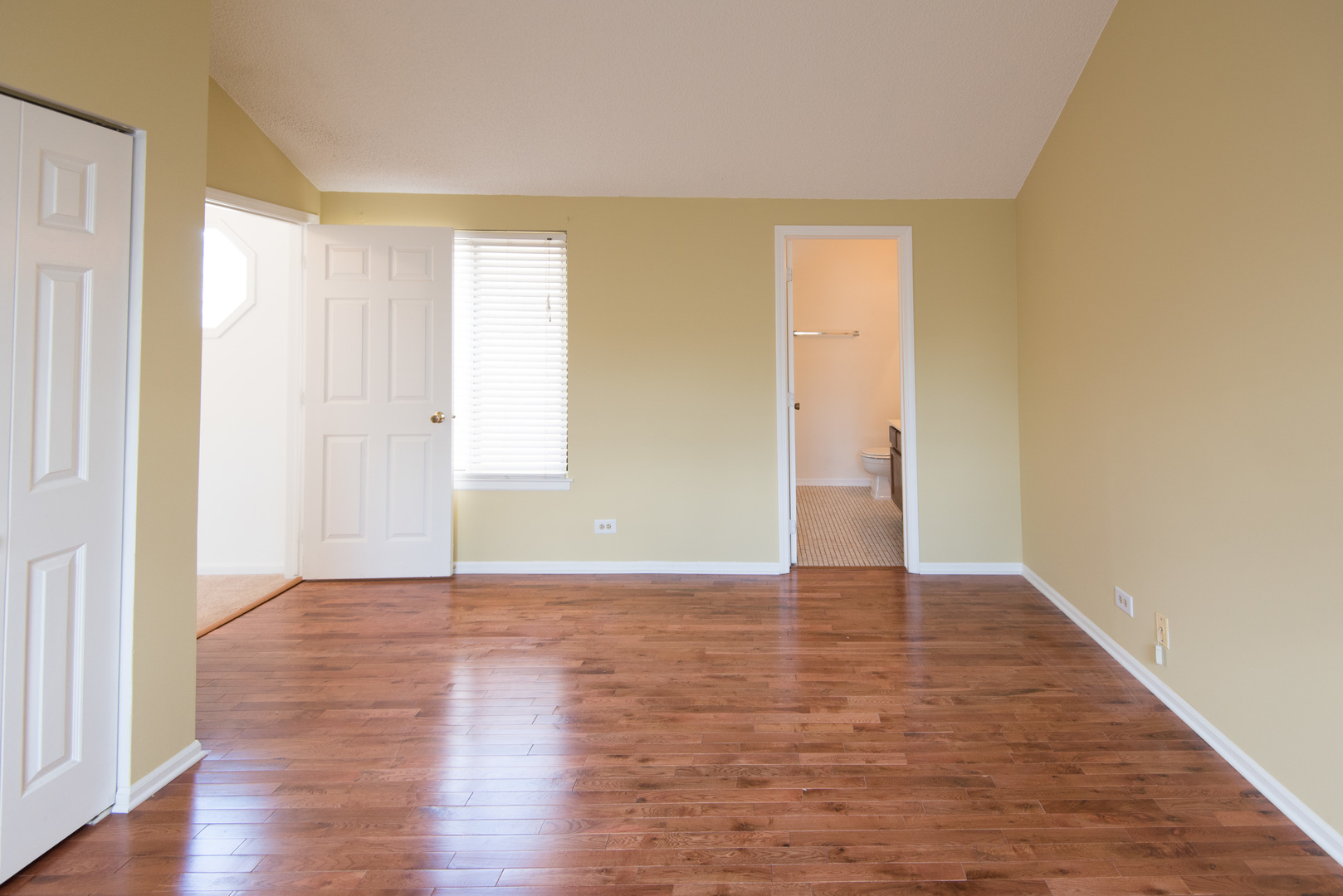 1201 Ranchview Court Buffalo Grove, IL 60089 - Photo 16 of 25 a view of an empty room with wooden floor and a window