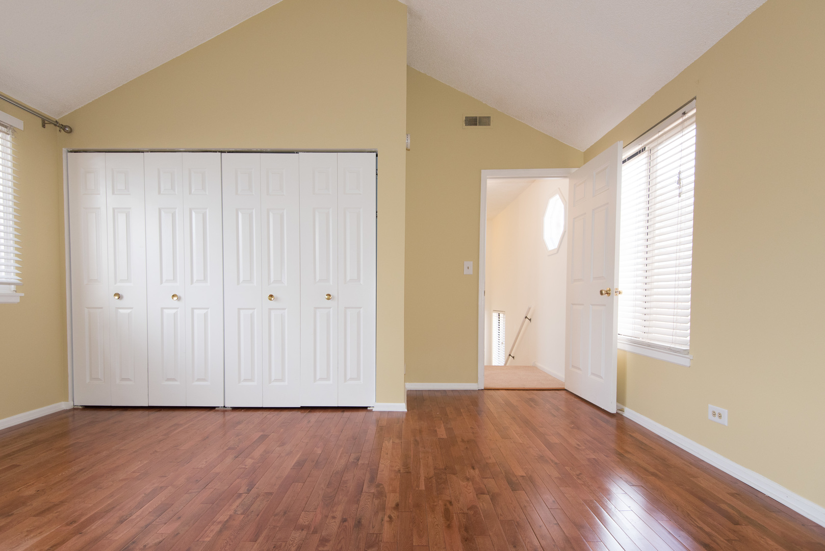 1201 Ranchview Court Buffalo Grove, IL 60089 - Photo 17 of 25 a view of an empty room with wooden floor and a window