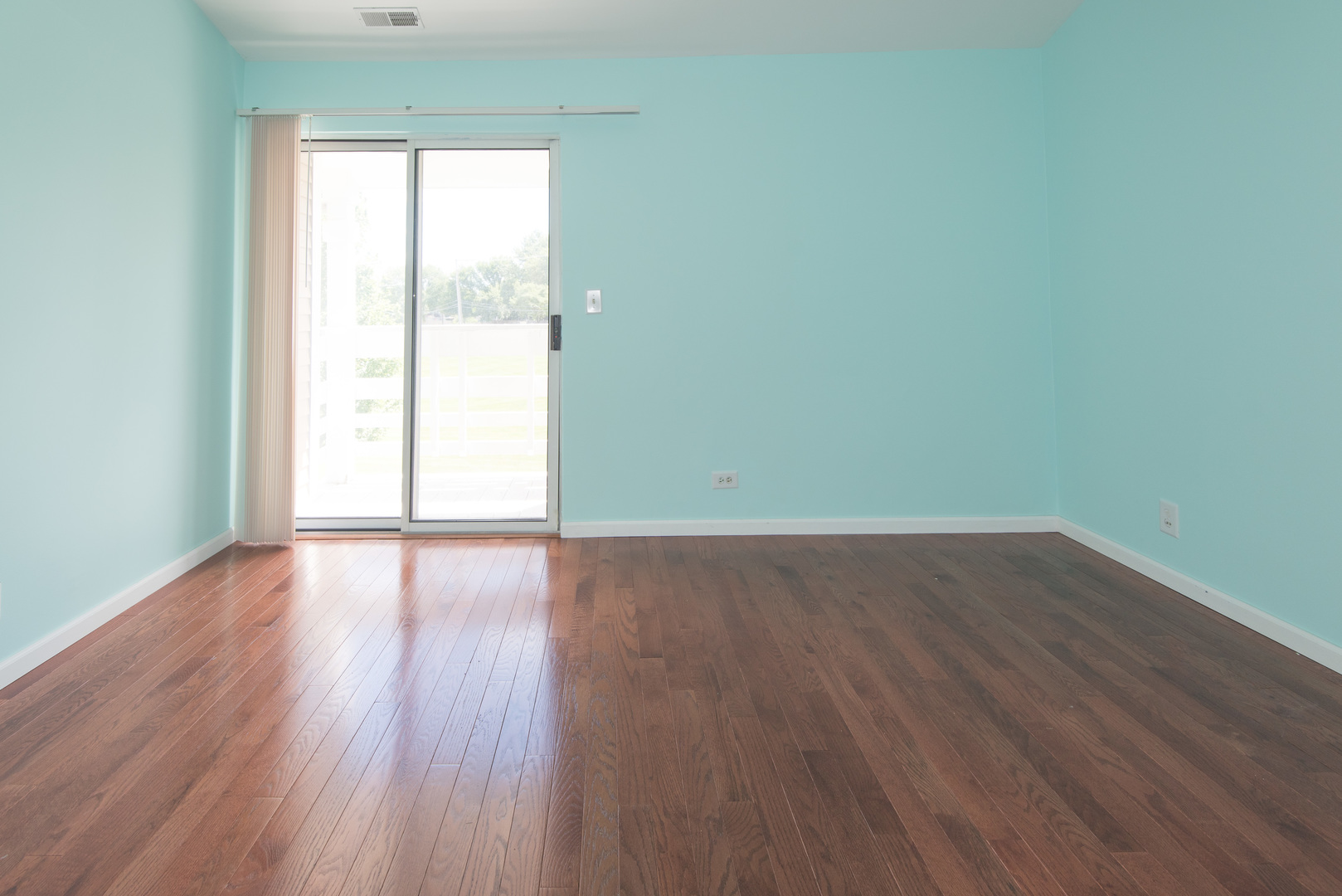 1201 Ranchview Court Buffalo Grove, IL 60089 - Photo 20 of 25 an empty room with wooden floor and windows
