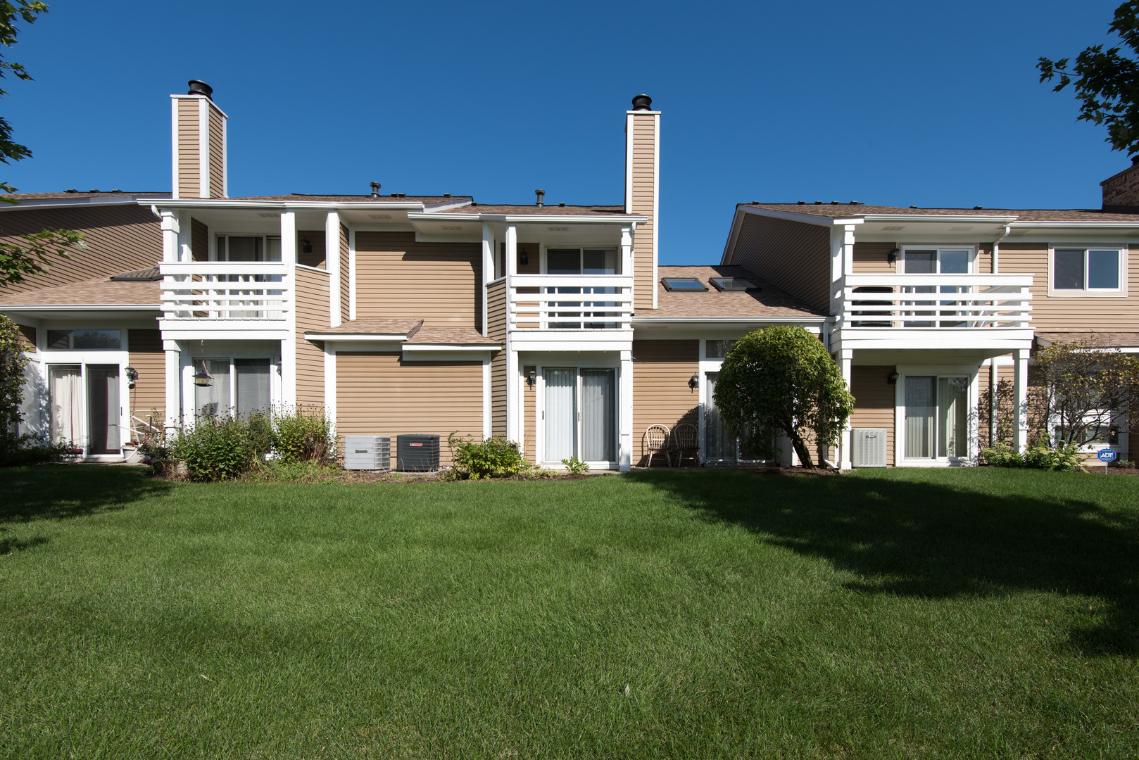 1201 Ranchview Court Buffalo Grove, IL 60089 - Photo 24 of 25 a front view of a building with a garden