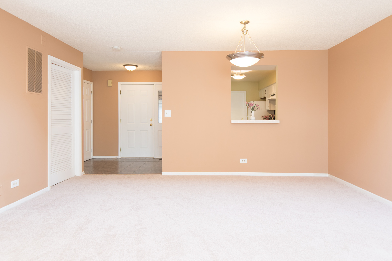 1201 Ranchview Court Buffalo Grove, IL 60089 - Photo 7 of 25 a view of a room with a stylish ceiling fan and entryway