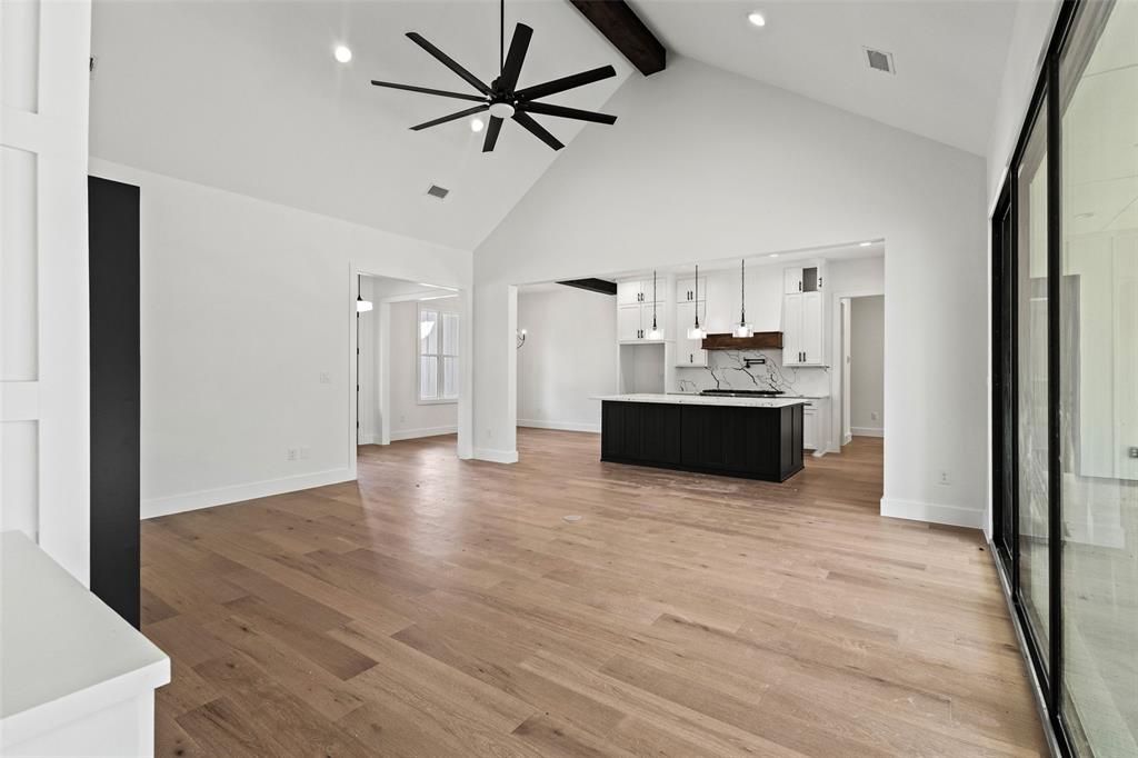 1418 Oak Hill Road Van Alstyne, TX 75495 - Photo 13 of 39 a view of a kitchen with a sink and a refrigerator wooden floor