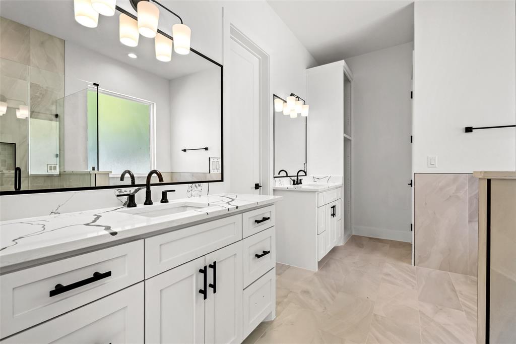 1418 Oak Hill Road Van Alstyne, TX 75495 - Photo 22 of 39 a spacious bathroom with double sink and a mirror