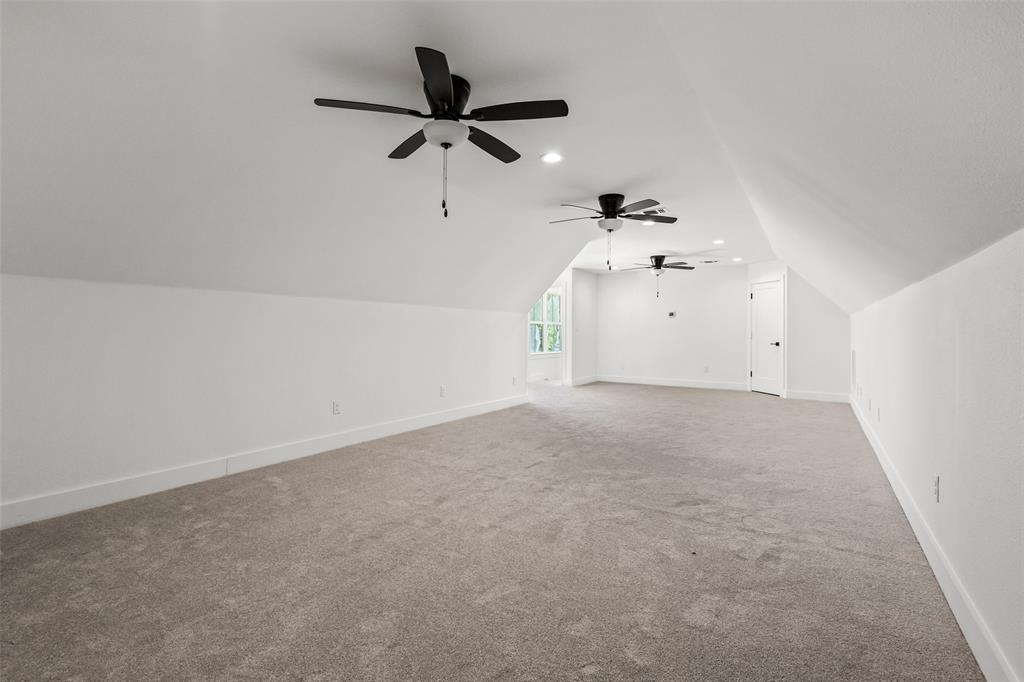 1418 Oak Hill Road Van Alstyne, TX 75495 - Photo 34 of 39 a view of a big room with a ceiling fan