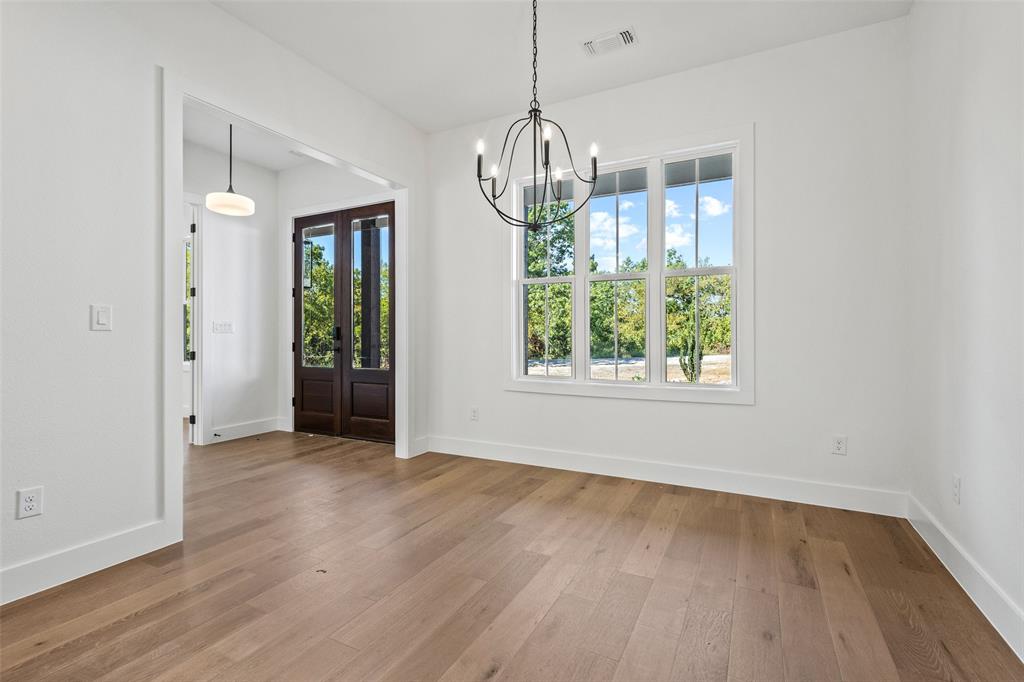 1418 Oak Hill Road Van Alstyne, TX 75495 - Photo 6 of 39 a view of empty room with wooden floor and window