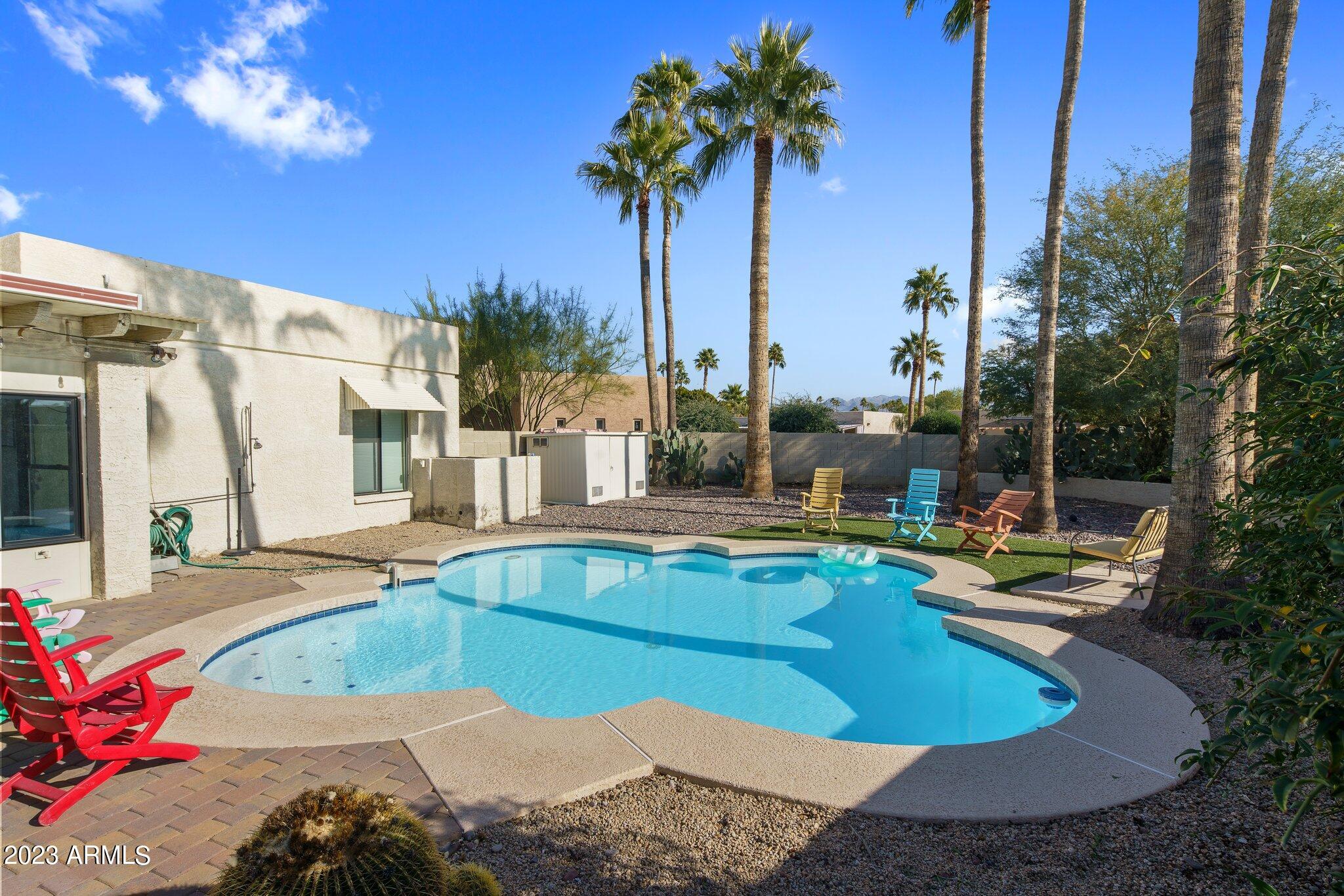 6609 East Phelps Road Scottsdale, AZ 85254 - Photo 28 of 83 a view of a swimming pool with a patio