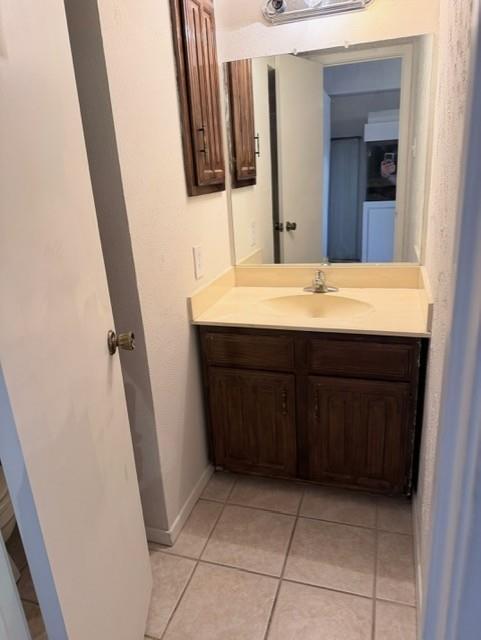 5626 Preston Oaks Road, Unit 4A Dallas, TX 75254 - Photo 11 of 15 a bathroom with a sink and a mirror