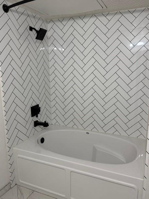 5626 Preston Oaks Road, Unit 4A Dallas, TX 75254 - Photo 7 of 15 a bathroom with a bathtub