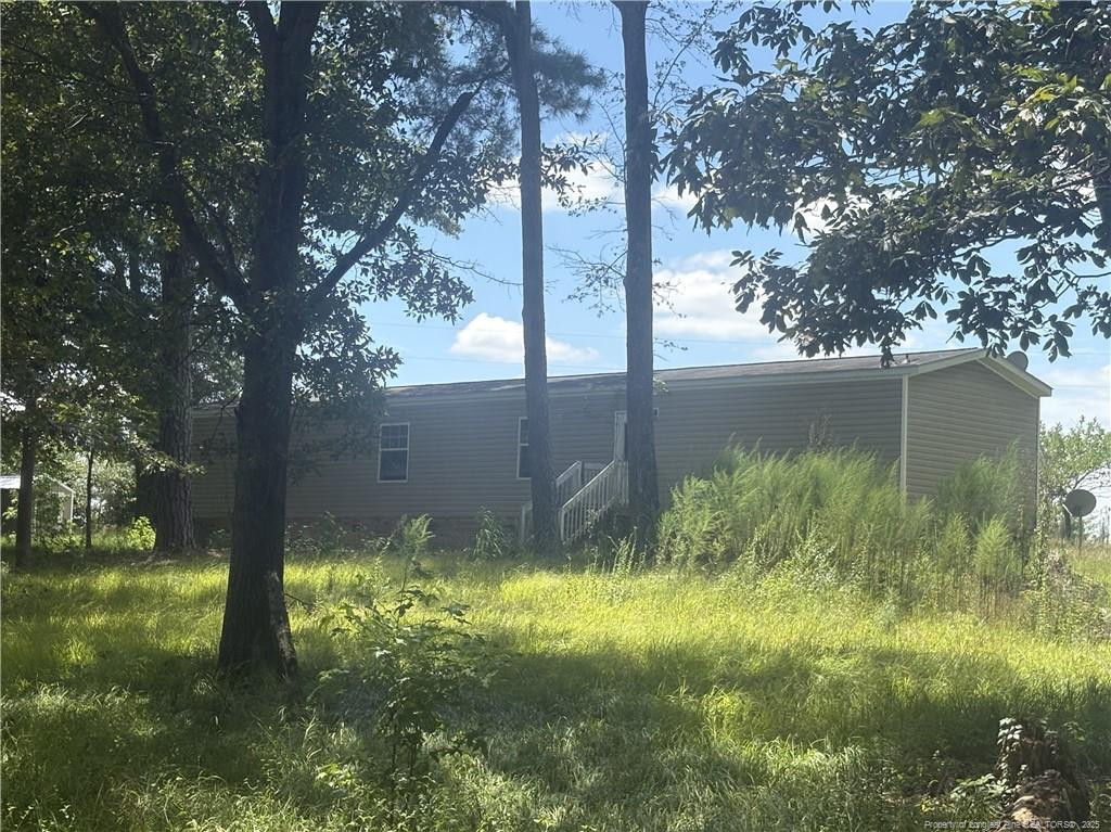 6566 Bend Of River Road Road Dunn, NC 28334 - Photo 19 of 20 a view of lake from a yard