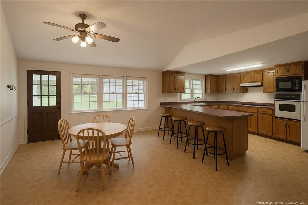 6566 Bend Of River Road Road Dunn, NC 28334 - Photo 3 of 20 a dining room with furniture and window