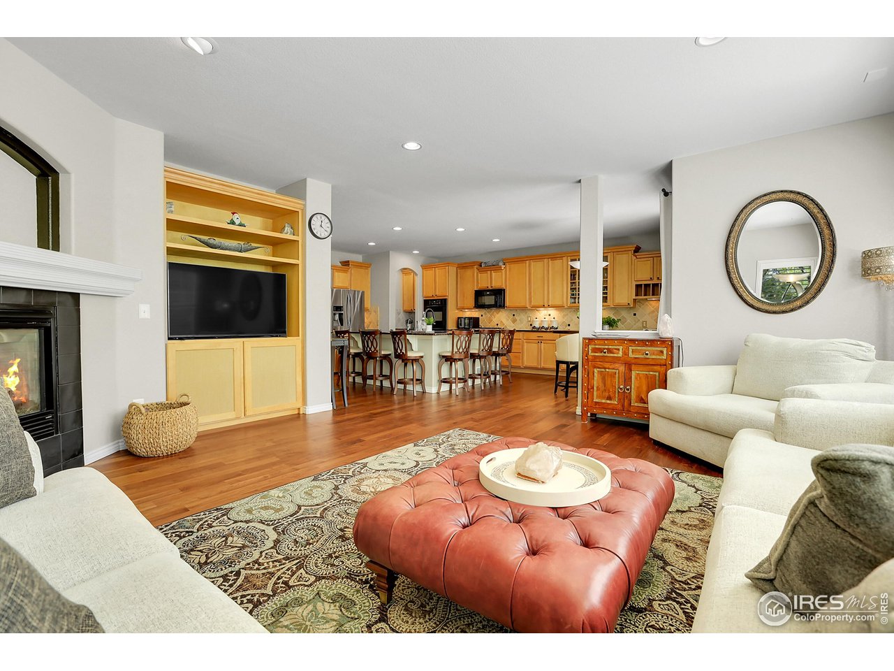 112 Austin Avenue Erie, CO 80516 - Photo 44 of 44 a living room with furniture a rug and a large window