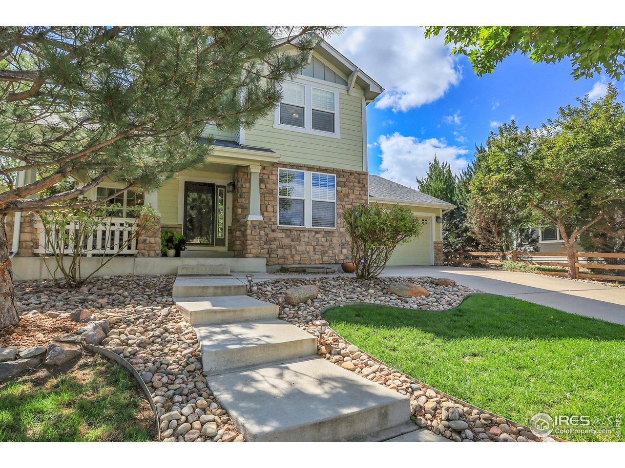 112 Austin Avenue Erie, CO 80516 - Photo 2 of 44 a front view of a house with a yard