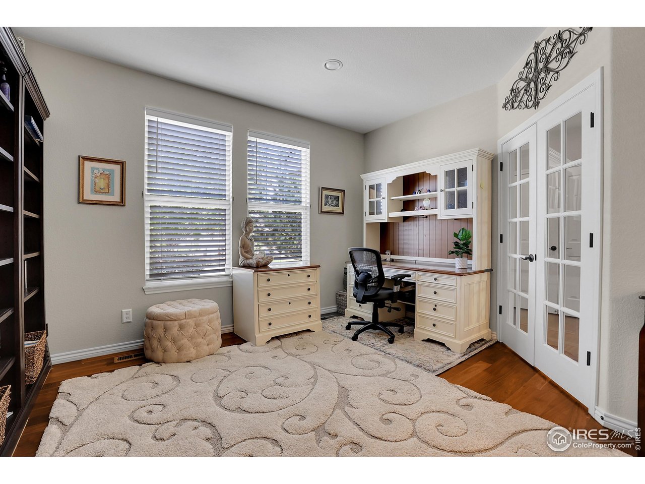 112 Austin Avenue Erie, CO 80516 - Photo 20 of 44 a bedroom with a bed and a large window