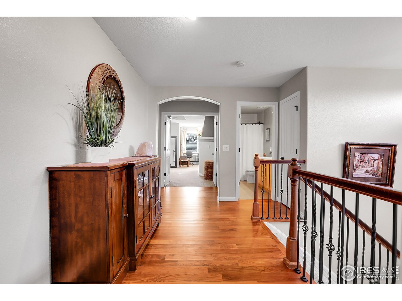112 Austin Avenue Erie, CO 80516 - Photo 23 of 44 a view of a hallway with wooden floor