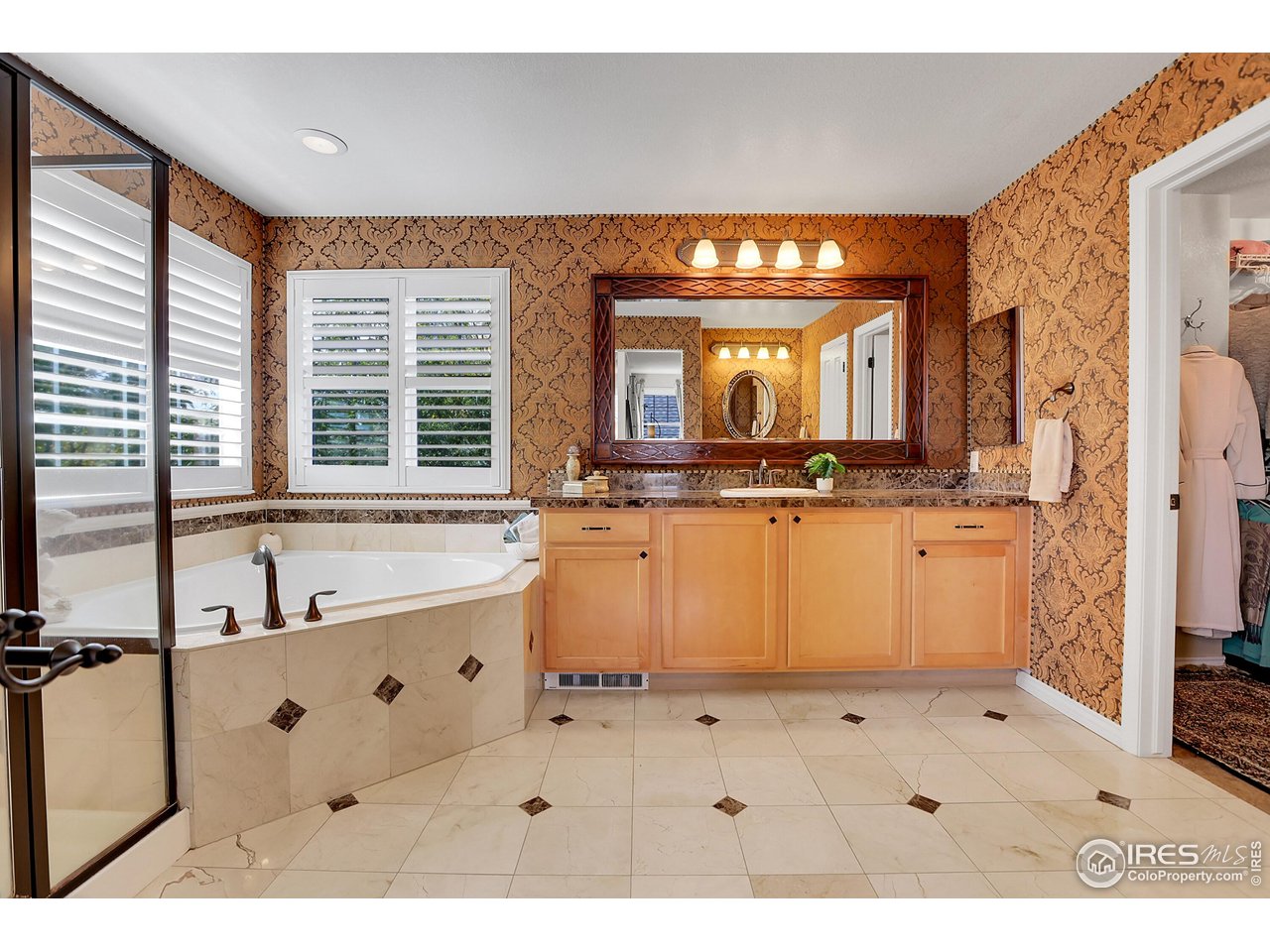 112 Austin Avenue Erie, CO 80516 - Photo 29 of 44 a bathroom with a sink mirror and a bathtub