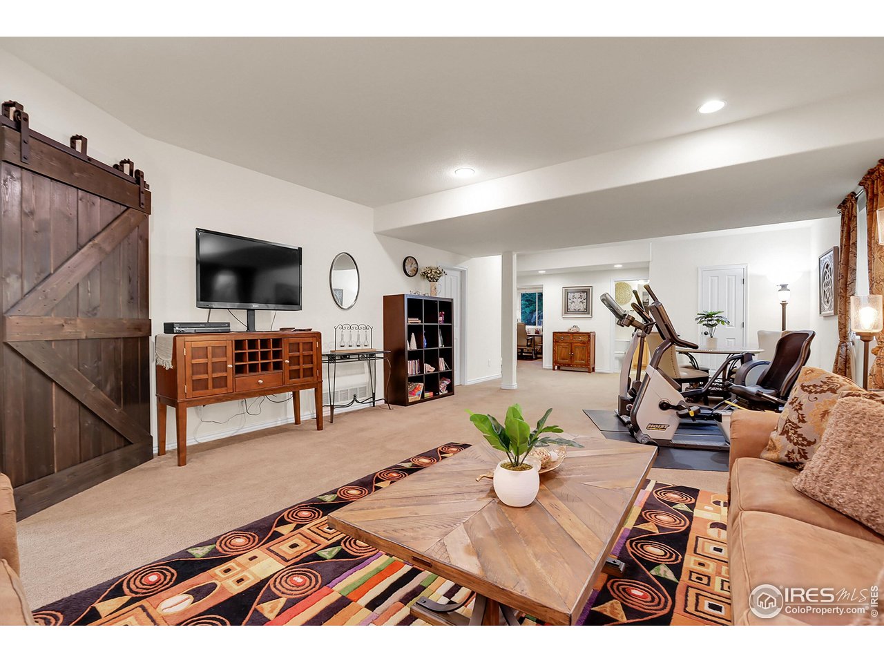 112 Austin Avenue Erie, CO 80516 - Photo 35 of 44 a living room with furniture and a flat screen tv