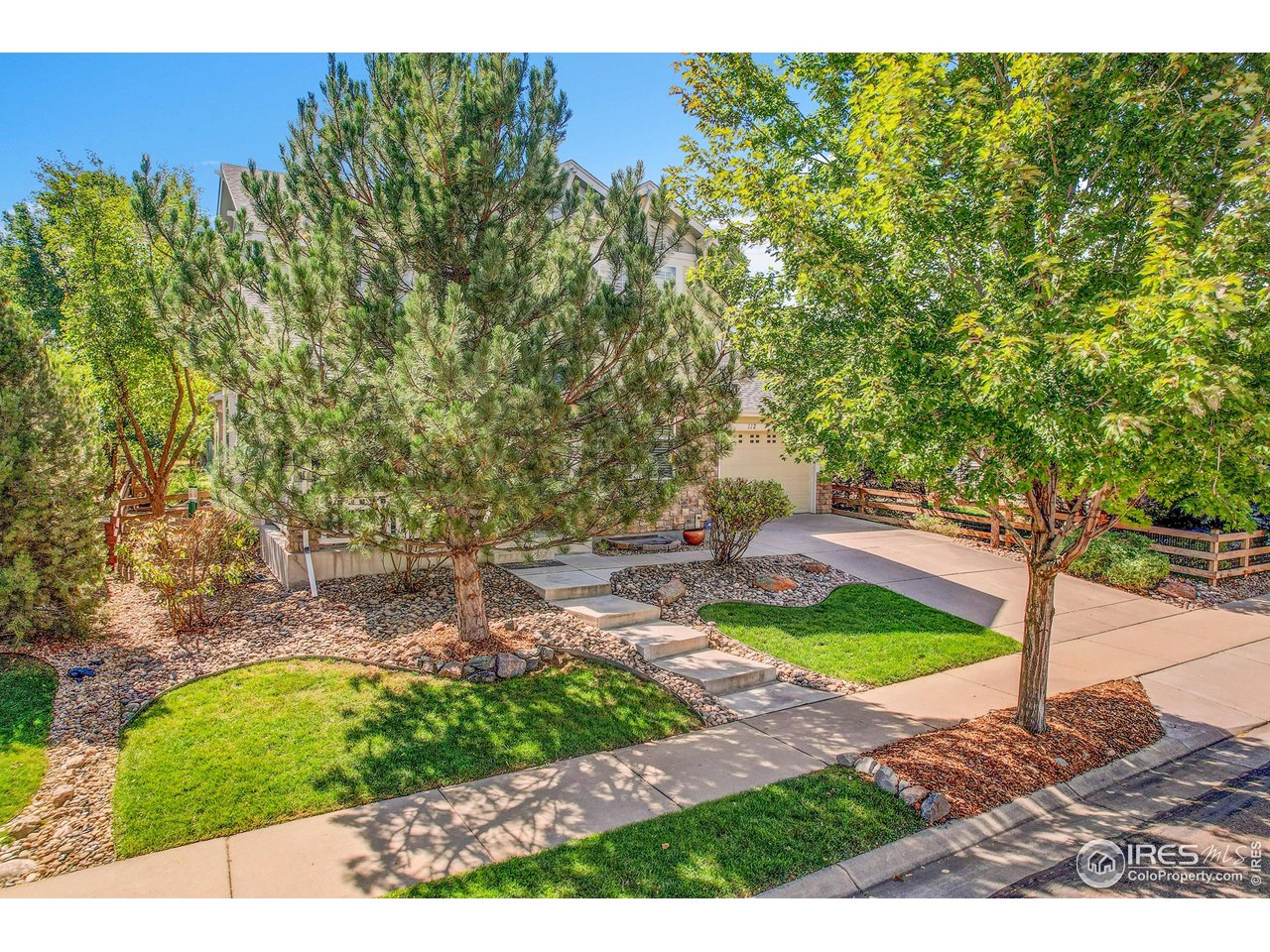 112 Austin Avenue Erie, CO 80516 - Photo 4 of 44 a view of a backyard with plants and a patio