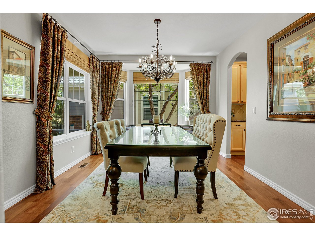 112 Austin Avenue Erie, CO 80516 - Photo 6 of 44 a view of a dining room with furniture wooden floor and chandelier