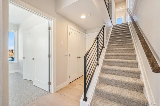 an empty room with closet and a bathroom