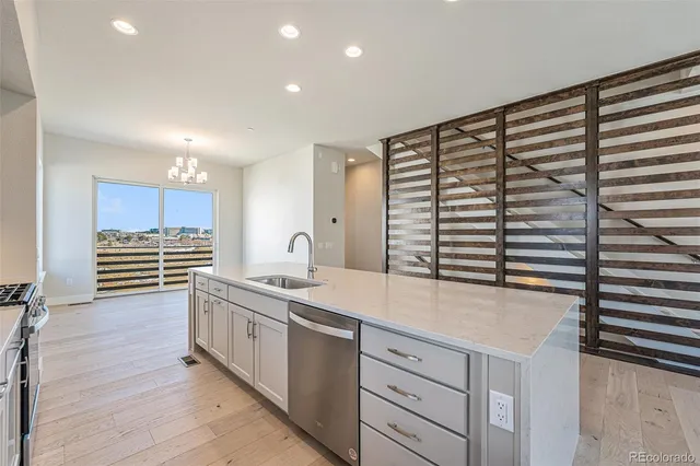 a kitchen with a sink and cabinets