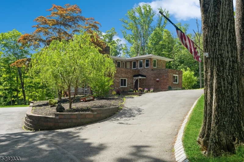 242 Lake Road Morristown, NJ 07960 - Photo 14 of 47 a front view of a house with a yard