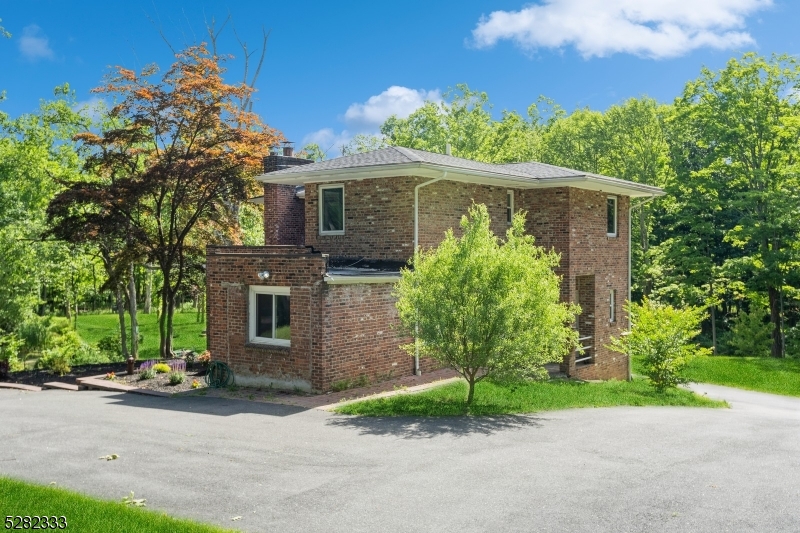 242 Lake Road Morristown, NJ 07960 - Photo 16 of 47 a front view of house with yard and green space