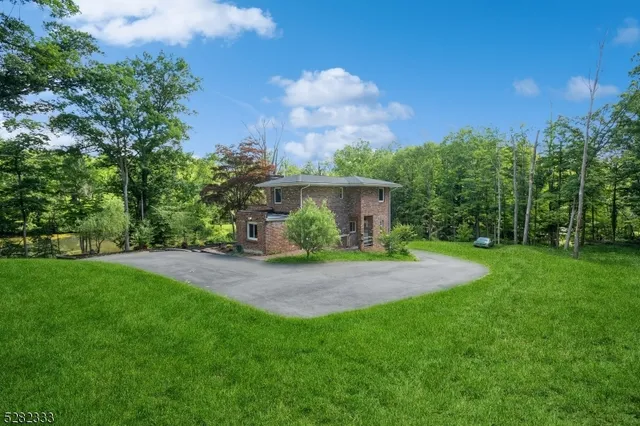 a living room with a fireplace and a wooden floor