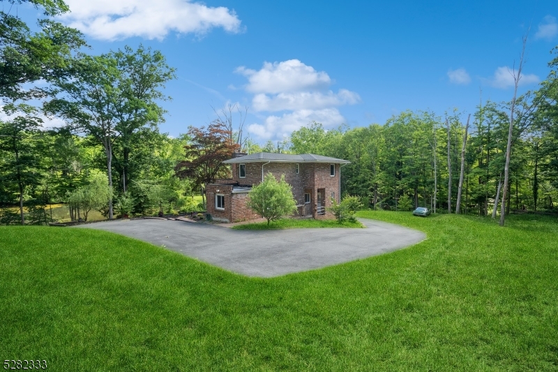242 Lake Road Morristown, NJ 07960 - Photo 17 of 47 a view of a yard with a house