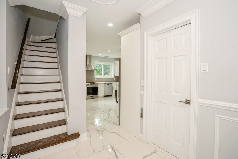 242 Lake Road Morristown, NJ 07960 - Photo 19 of 47 a view of a hallway with a door and stairs