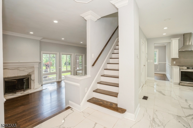 242 Lake Road Morristown, NJ 07960 - Photo 20 of 47 a view of entryway with wooden floor and fire place