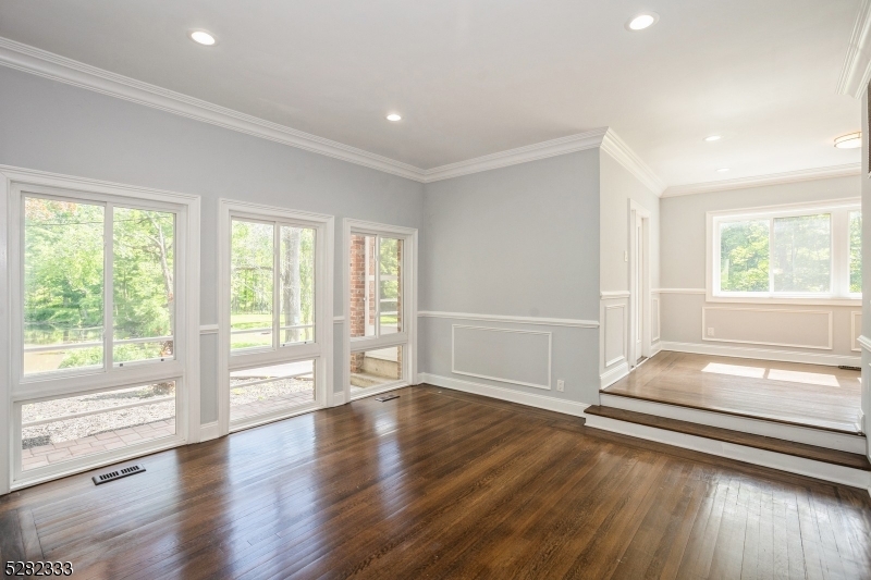 242 Lake Road Morristown, NJ 07960 - Photo 24 of 47 an empty room with wooden floor and windows