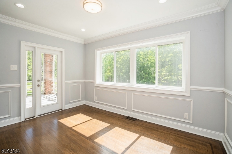 242 Lake Road Morristown, NJ 07960 - Photo 31 of 47 a view of empty room with wooden floor and fan