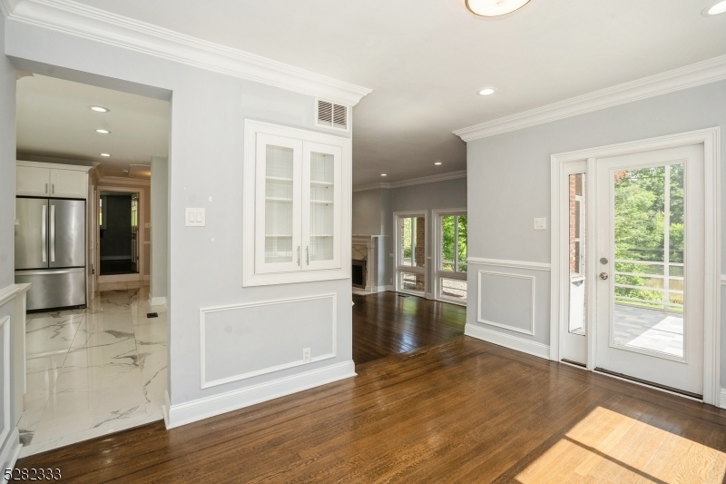 242 Lake Road Morristown, NJ 07960 - Photo 32 of 47 an empty room with wooden floor and windows