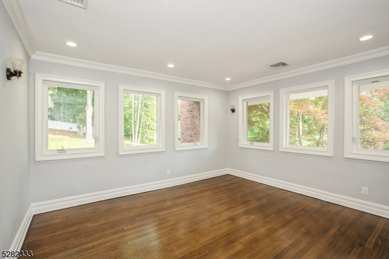 242 Lake Road Morristown, NJ 07960 - Photo 33 of 47 a view of an empty room with wooden floor and a window