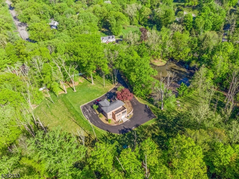 242 Lake Road Morristown, NJ 07960 - Photo 4 of 47 an aerial view of a house with a yard