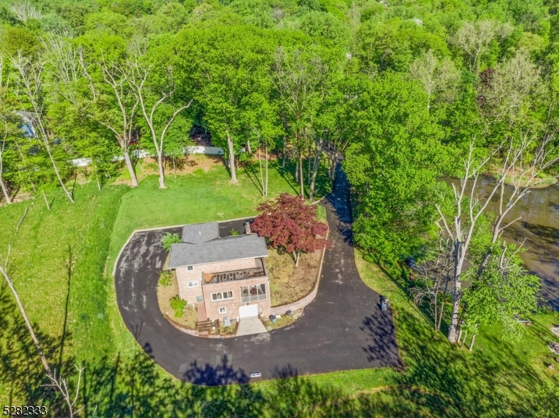 242 Lake Road Morristown, NJ 07960 - Photo 10 of 47 a view of a swimming pool with a yard