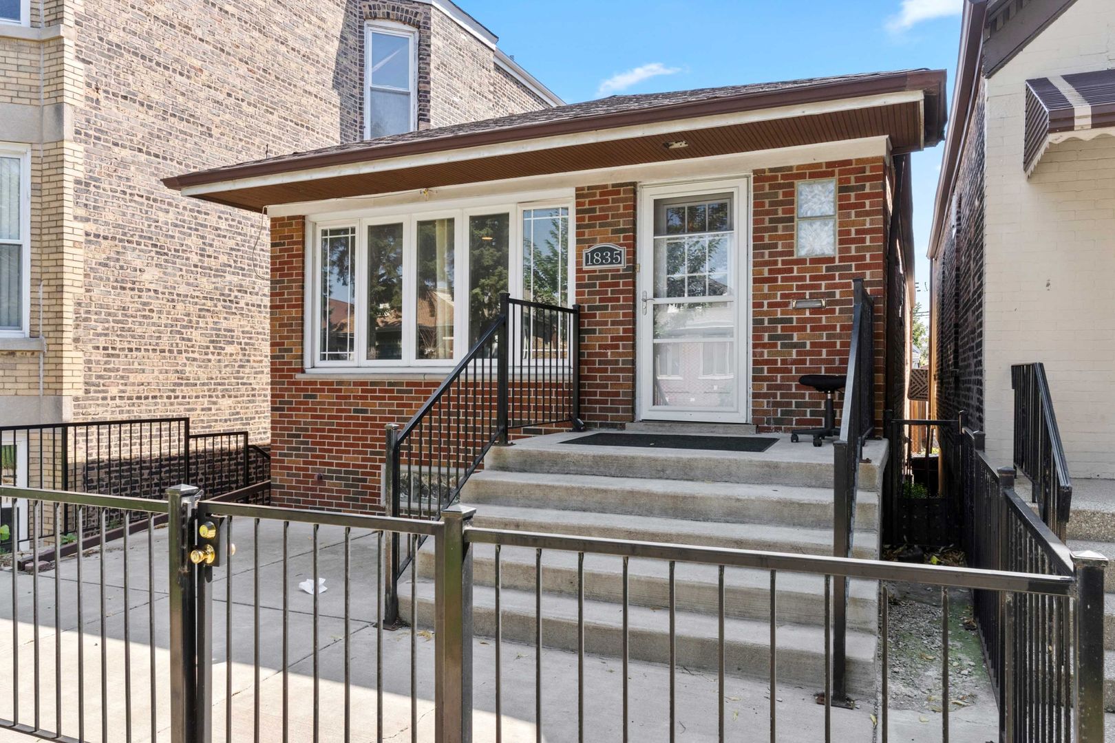 1835 West 34th Street Chicago, IL 60608 - Photo 1 of 22 a front view of a house with a porch