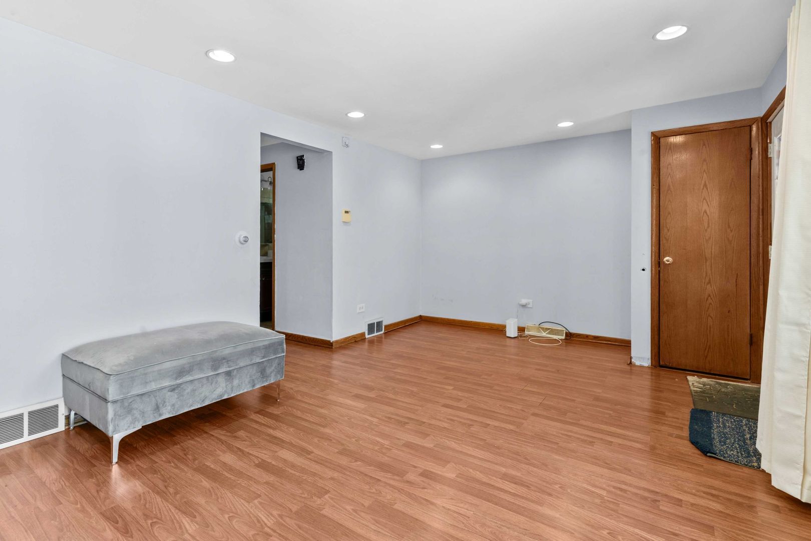 1835 West 34th Street Chicago, IL 60608 - Photo 4 of 22 a view of room with wooden floor and bedroom