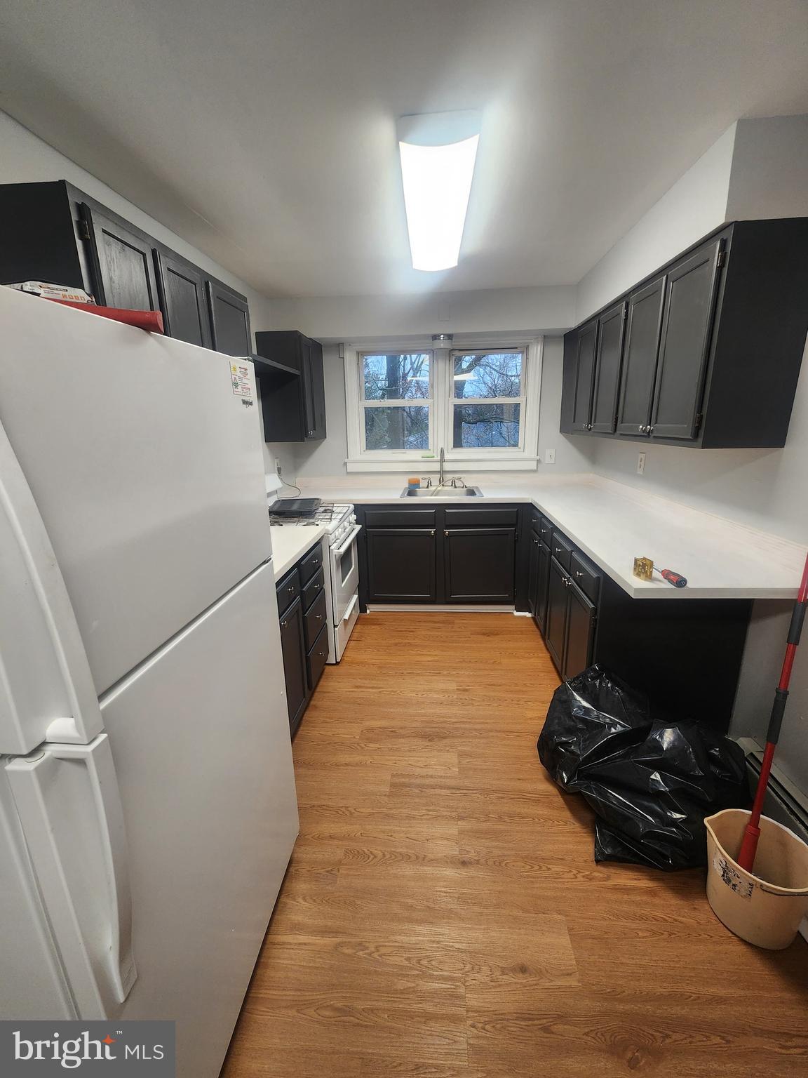 17 Malan Avenue Berlin, NJ 08009 - Photo 3 of 10 a kitchen with a refrigerator and a stove top oven