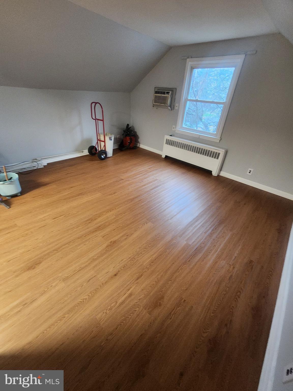 17 Malan Avenue Berlin, NJ 08009 - Photo 4 of 10 an empty room with wooden floor and windows
