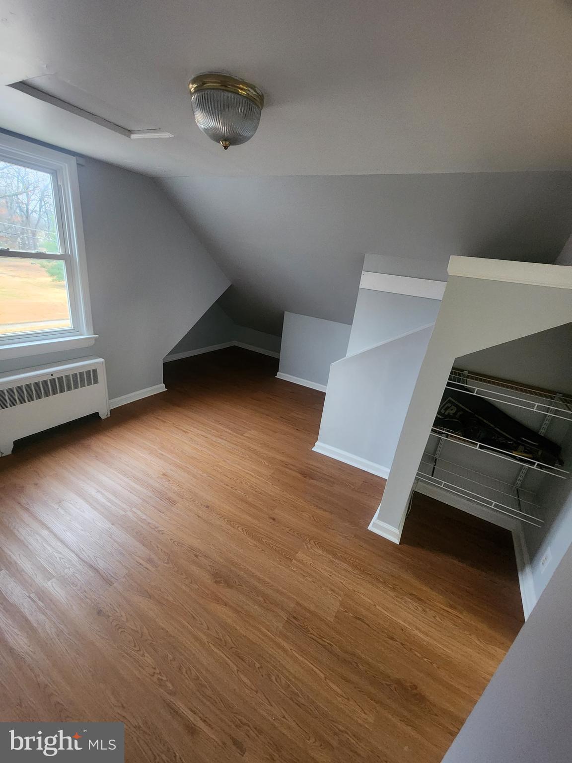 17 Malan Avenue Berlin, NJ 08009 - Photo 9 of 10 a view of an empty room with wooden floor and a window
